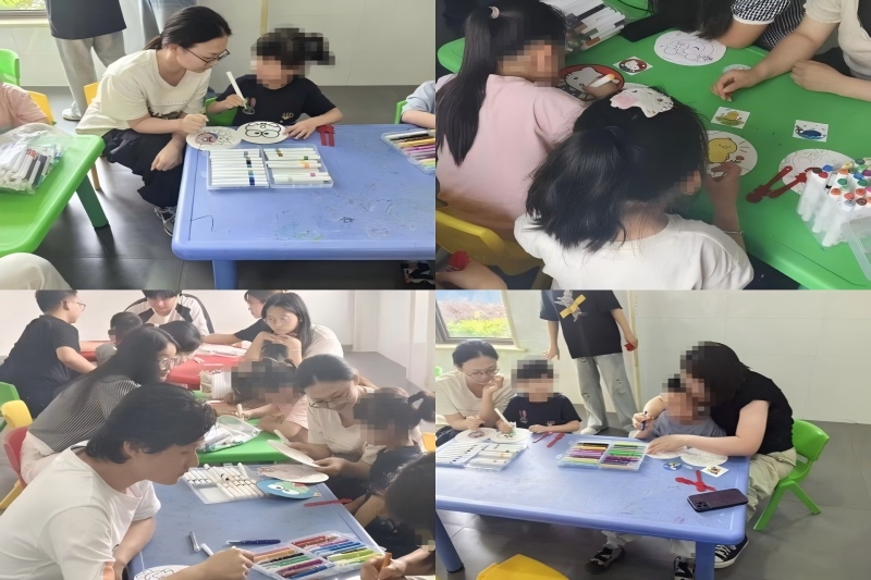 图为各志愿者陪伴孩子完成手工作品.jpg